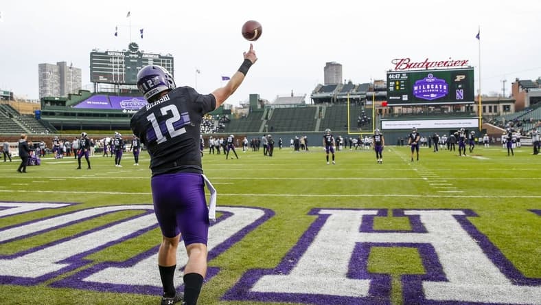 Nov 20, 2021; Chicago, Illinois, USA; Northwestern Wildcats quarterback Ryan Hilinski (12) warms up before the game between the Northwestern Wildcats and the Purdue Boilermakers at Wrigley Field. Mandatory Credit: Jon Durr-USA TODAY Sports