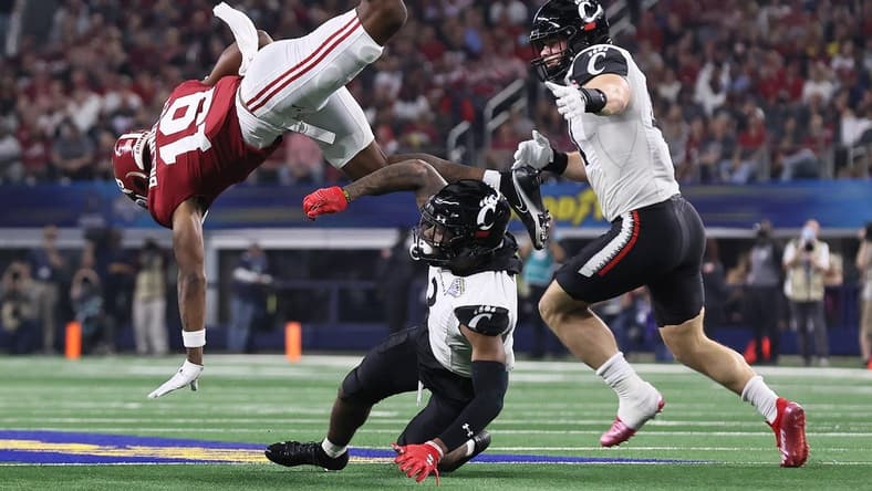 Dec 31, 2021; Arlington, Texas, USA; Alabama Crimson Tide receiver Jahleel Billingsley (19) is upended after a reception in the first quarter by Cincinnati Bearcats safety Ja'Von HIcks (3) during the 2021 Cotton Bowl college football CFP national semifinal game at AT&T Stadium. Mandatory Credit: Matthew Emmons-USA TODAY Sports