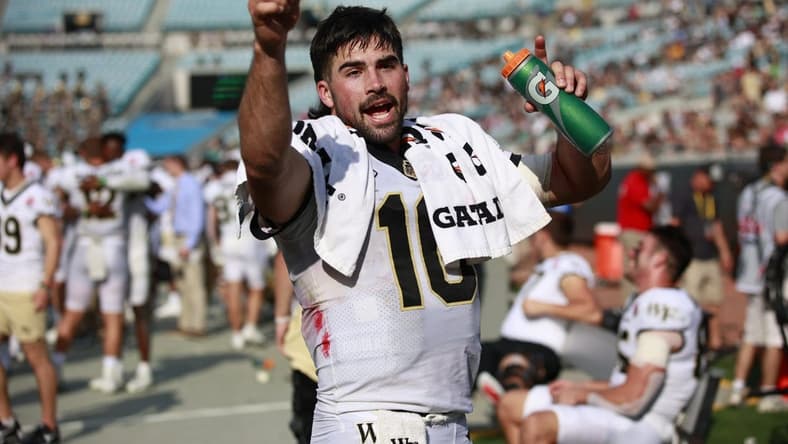 Wake Forest Demon Deacons quarterback Sam Hartman (10) gets ready to celebrate during the fourth quarter Friday, Dec. 31, 2021 at TIAA Bank Field in Jacksonville. The Wake Forest Demon Deacons and the Rutgers Scarlet Knights faced each other in the 2021 TaxSlayer Gator Bowl. Wake Forest defeated Rutgers 38-10. [Corey Perrine/Florida Times-Union]