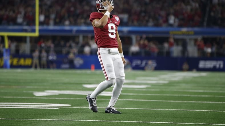 Dec 31, 2021; Arlington, Texas, USA; Alabama Crimson Tide quarterback Bryce Young (9) reacts after throwing a touchdown in the fourth quarter against the Cincinnati Bearcats during the 2021 Cotton Bowl college football CFP national semifinal game at AT&T Stadium. Mandatory Credit: Tim Heitman-USA TODAY Sports