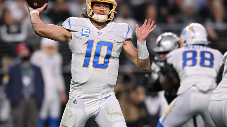 Jan 9, 2022; Paradise, Nevada, USA; Los Angeles Chargers quarterback Justin Herbert (10) throws a pass against the Las Vegas Raiders during the second half at Allegiant Stadium. Mandatory Credit: Orlando Ramirez-USA TODAY Sports