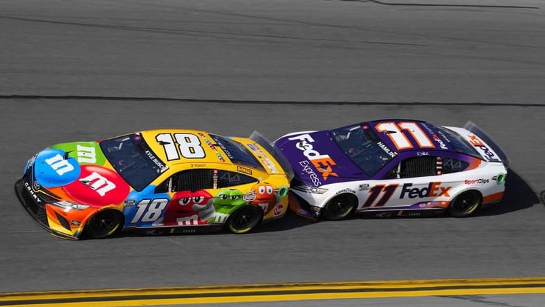 Feb 20, 2022; Daytona Beach, Florida, USA; NASCAR Cup Series driver Denny Hamlin (11) drafts with driver Kyle Busch (18) during the Daytona 500 at Daytona International Speedway. Mandatory Credit: Mike Dinovo-USA TODAY Sports