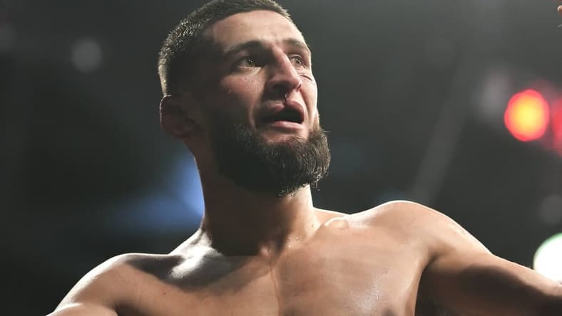 Apr 9, 2022; Jacksonville, Florida, USA; Khamzat Chimaev (blue gloves) after a fight against Gilbert Burns (red gloves) during UFC 273 at VyStar Veterans Memorial Arena. Mandatory Credit: David Yeazell-USA TODAY Sports