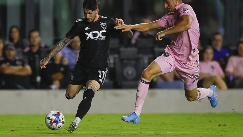 May 14, 2022; Fort Lauderdale, Florida, USA; D.C. United forward Taxiarchis Fountas (11) controls the ball against Inter Miami CF defender Christopher McVey (4) during the second half at DRV PNK Stadium. Mandatory Credit: Sam Navarro-USA TODAY Sports
