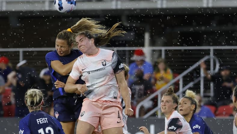 May 15, 2022; Washington, District of Columbia, USA; Washington Spirit defender Sam Staab (3) and Angel City FC defender Vanessa Gilles (4) leap to head the ball in the second half at Audi Field. Mandatory Credit: Geoff Burke-USA TODAY Sports