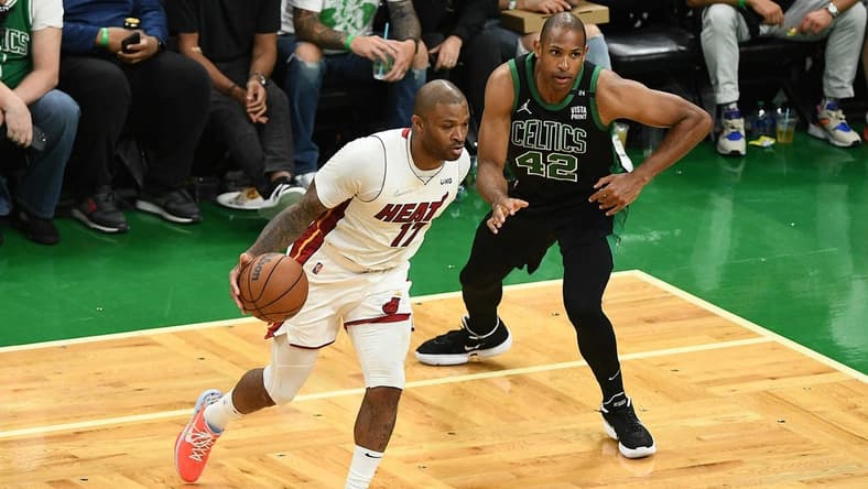 May 27, 2022; Boston, Massachusetts, USA; Miami Heat forward P.J. Tucker (17) moves the ball against Boston Celtics center Al Horford (42) during the second half in game six of the 2022 eastern conference finals at TD Garden. Mandatory Credit: Brian Fluharty-USA TODAY Sports