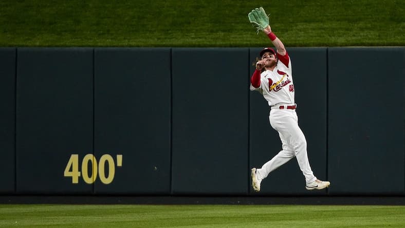 Jun 10, 2022; St. Louis, Missouri, USA; St. Louis Cardinals center fielder Harrison Bader (48) leaps to catch a line drive against the Cincinnati Reds during the fourth inning at Busch Stadium. Mandatory Credit: Jeff Curry-USA TODAY Sports