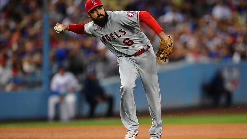 Jun 14, 2022; Los Angeles, California, USA; Los Angeles Angels third baseman Anthony Rendon (6) throws to first after fielding the ball hit for a single by Los Angeles Dodgers shortstop Trea Turner (6) during the fourth inning at Dodger Stadium. Mandatory Credit: Gary A. Vasquez-USA TODAY Sports