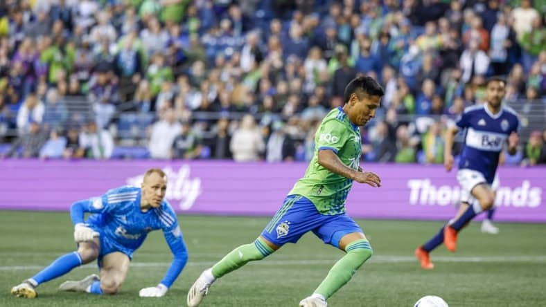 Jun 14, 2022; Seattle, Washington, USA; Seattle Sounders FC forward Raul Ruidiaz (9) attempts a shot on the goal against the Vancouver Whitecaps during the second half at Lumen Field. Mandatory Credit: Joe Nicholson-USA TODAY Sports
