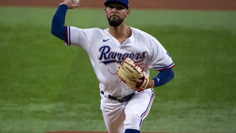 Jun 15, 2022; Arlington, Texas, USA; Texas Rangers starting pitcher Tyson Miller (76) pitches against the Houston Astros during the first inning at Globe Life Field. Mandatory Credit: Jerome Miron-USA TODAY Sports