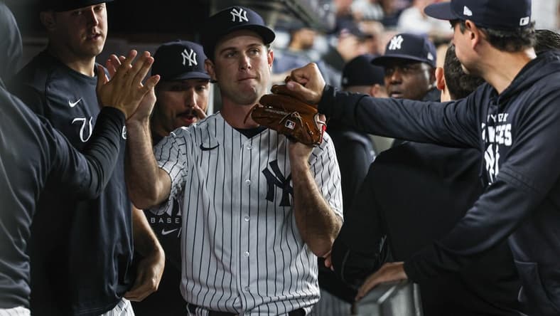 Jun 16, 2022; Bronx, New York, USA; New York Yankees relief pitcher Ryan Weber (85) is congratulated by teammates after being relieved from the game during the seventh inning against the Tampa Bay Rays at Yankee Stadium. Mandatory Credit: Vincent Carchietta-USA TODAY Sports