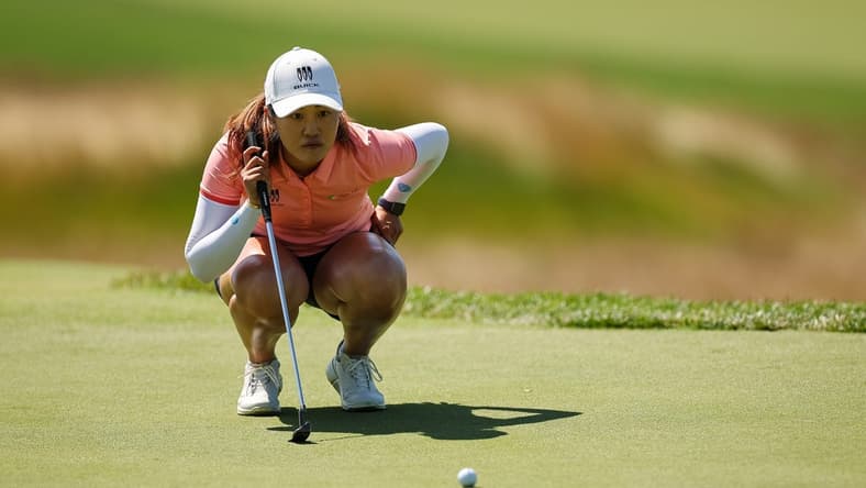Jun 25, 2022; Bethesda, Maryland, USA; Xiyu Lin lines up a putt on the second green during the third round of the KPMG Women's PGA Championship golf tournament at Congressional Country Club. Mandatory Credit: Scott Taetsch-USA TODAY Sports