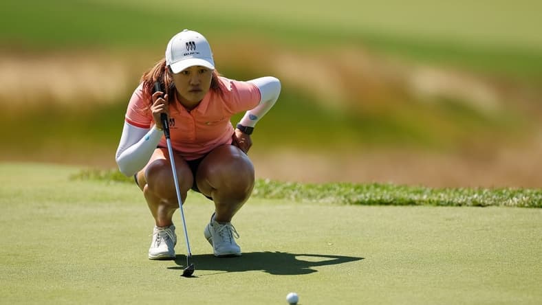 Jun 25, 2022; Bethesda, Maryland, USA; Xiyu Lin lines up a putt on the second green during the third round of the KPMG Women's PGA Championship golf tournament at Congressional Country Club. Mandatory Credit: Scott Taetsch-USA TODAY Sports