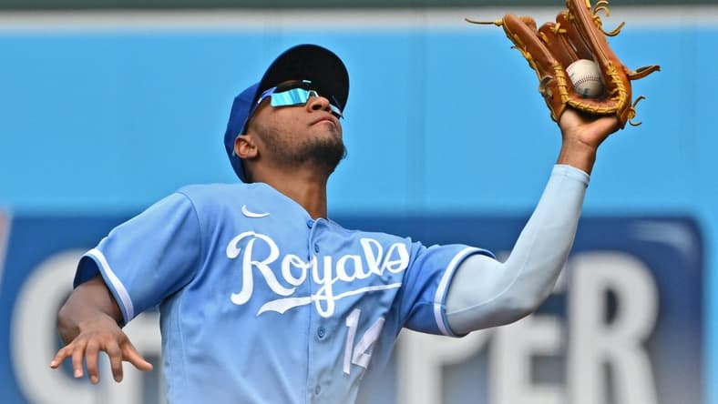 Jun 25, 2022; Kansas City, Missouri, USA; Kansas City Royals right fielder Edward Olivares (14) catches a fly ball in foul territory during the third inning against the Oakland Athletics at Kauffman Stadium. Mandatory Credit: Peter Aiken-USA TODAY Sports