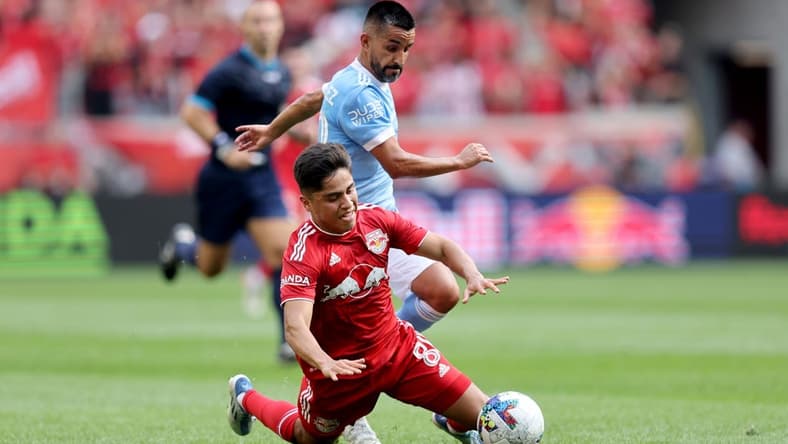 Jul 17, 2022; Harrison, New Jersey, USA; New York City midfielder Maximiliano Moralez (10) and New York Red Bulls midfielder Frankie Amaya (8) fight for the ball during the first half at Red Bull Arena. Mandatory Credit: Brad Penner-USA TODAY Sports
