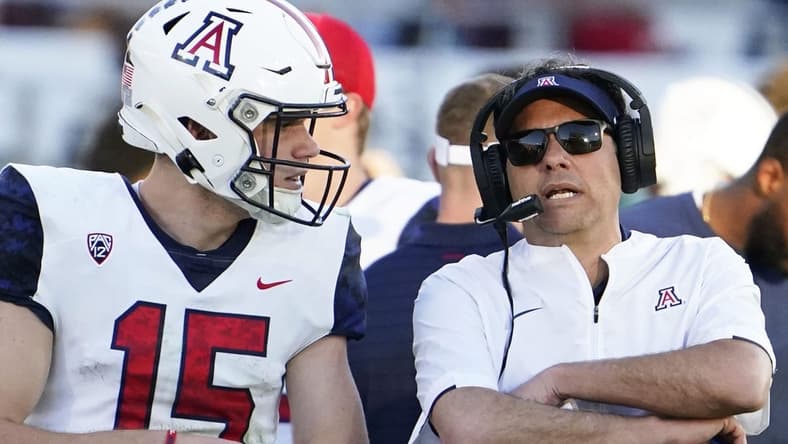 Nov 27, 2021; Tempe, Arizona, USA; Arizona Wildcats quarterback Will Plummer (15) talks to head coach Jedd Fisch during action against the Arizona State Sun Devils during the 95th Territorial Cup game at Sun Devil Stadium.
Syndication Arizona Republic