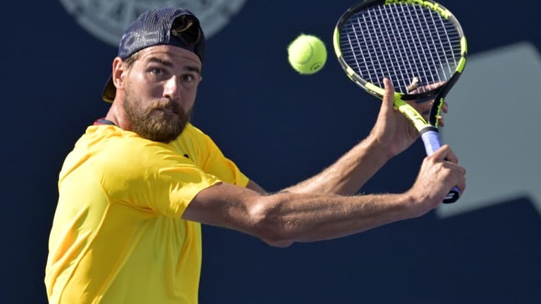 Aug 10, 2022; Montreal, QC, Canada; Maxime Cressy (USA) hits a backhand against Gael Monfils (FRA) (not pictured) in second round play at IGA Stadium. Mandatory Credit: Eric Bolte-USA TODAY Sports