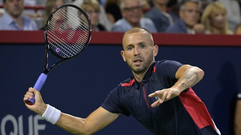 Aug 13, 2022; Montreal, QC, Canada; Daniel Evans (GBR) hits a forehand against Pablo Carreno Busta (ESP) (not pictured) in semifinal play in the National Bank Open at IGA Stadium. Mandatory Credit: Eric Bolte-USA TODAY Sports