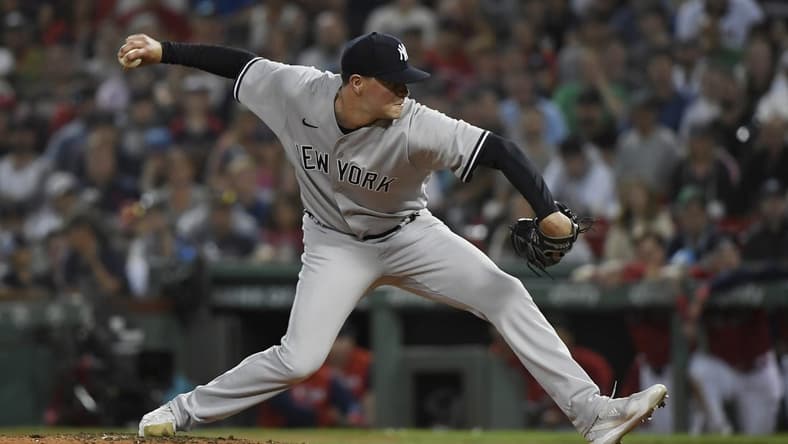 Aug 13, 2022; Boston, Massachusetts, USA; New York Yankees relief pitcher Scott Effross (59) pitches during the ninth inning against the Boston Red Sox at Fenway Park. Mandatory Credit: Bob DeChiara-USA TODAY Sports