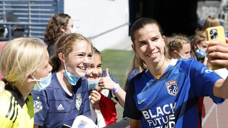 Aug 14, 2022; Seattle, Washington, USA; OL Reign forward Tobin Heath (77) reacts with fans after the game against the NJ/NY Gotham FC at Lumen Field. Mandatory Credit: Joe Nicholson-USA TODAY Sports