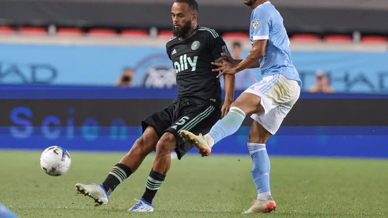 Aug 17, 2022; Harrison, New Jersey, USA; Charlotte FC defender Anton Walkes (5) plays the ball against New York City FC forward Heber (9) during the second half at Red Bull Arena. Mandatory Credit: Vincent Carchietta-USA TODAY Sports