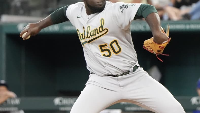 Aug 18, 2022; Arlington, Texas, USA; Oakland Athletics relief pitcher Domingo Tapia (50) delivers a pitch to the Texas Rangers during the fifth inning at Globe Life Field. Mandatory Credit: Jim Cowsert-USA TODAY Sports
