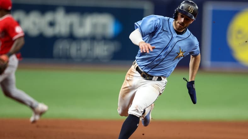 Aug 24, 2022; St. Petersburg, Florida, USA;  Tampa Bay Rays second baseman Brandon Lowe (8) rounds third base against the Los Angeles Angels in the eleventh inning at Tropicana Field. Mandatory Credit: Nathan Ray Seebeck-USA TODAY Sports