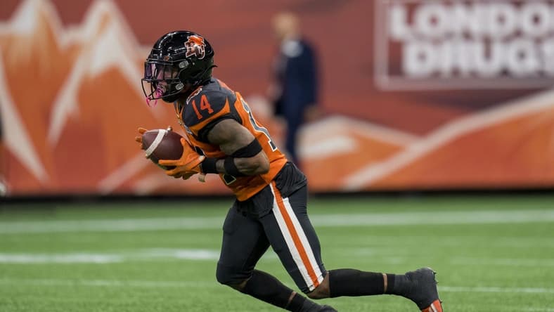 Aug 26, 2022; Vancouver, British Columbia, CAN; BC Lions defensive back Marcus Sayles (14) returns a punt against the Saskatchewan Roughriders in the second half at BC Place. Mandatory Credit: Bob Frid-USA TODAY Sports