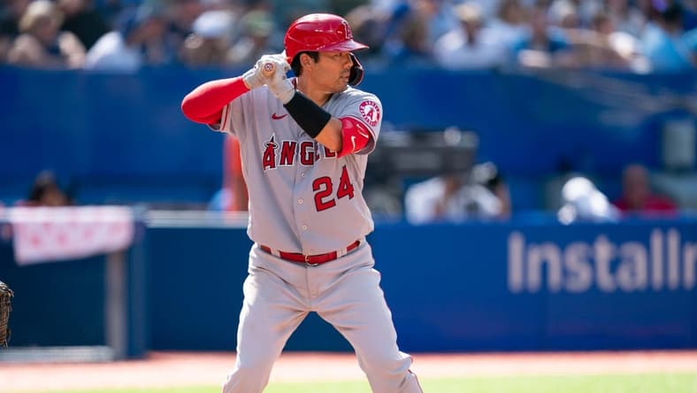 Aug 28, 2022; Toronto, Ontario, CAN; Los Angeles Angels catcher Kurt Suzuki (24) waits for a pitch against the Toronto Blue Jays during the seventh inning at Rogers Centre. Mandatory Credit: Nick Turchiaro-USA TODAY Sports