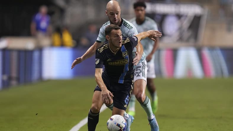 Aug 31, 2022; Chester, Pennsylvania, USA; Philadelphia Union midfielder Daniel Gazdag (6) controls the ball against Atlanta United defender Andrew Gutman (15) in the first half at Subaru Park. Mandatory Credit: Mitchell Leff-USA TODAY Sports