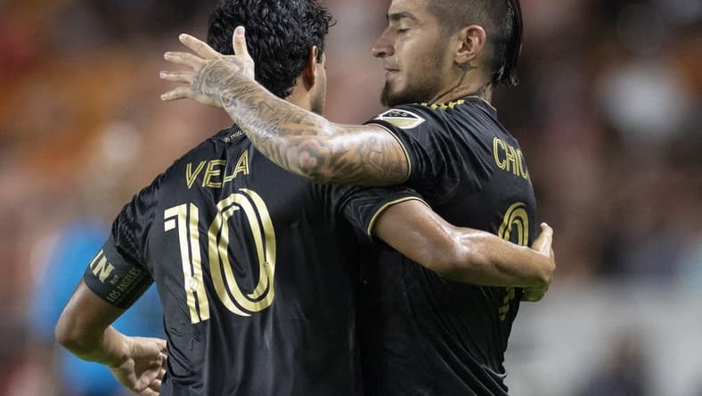 Aug 31, 2022; Houston, Texas, USA;  Los Angeles FC forward Carlos Vela (10) celebrates forward Cristian Arango (9) goal against the Houston Dynamo FC in the first half at PNC Stadium. Mandatory Credit: Thomas Shea-USA TODAY Sports