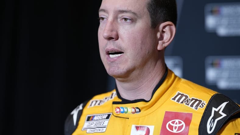 Sep 1, 2022; Charlotte, NC, USA; NASCAR Cup Series driver Kyle Busch (18) talks with the media during the NASCAR Cup Series Playoff Media Day at Charlotte Convention Center. Mandatory Credit: Jim Dedmon-USA TODAY Sports