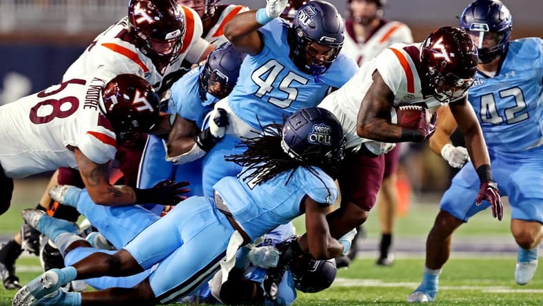Sep 2, 2022; Norfolk, Virginia, USA;  Virginia Tech Hokies running back Jalen Holston (0) runs the ball during the second quarter against Old Dominion Monarchs defensive tackle Denzel Lowry (45) at Kornblau Field at S.B. Ballard Stadium. Mandatory Credit: Peter Casey-USA TODAY Sports
