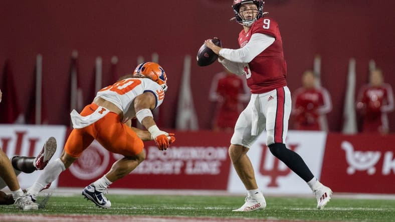 Sep 2, 2022; Bloomington, Indiana, USA; Indiana Hoosiers quarterback Connor Bazelak (9) drops back to pass the ball while Illinois Fighting Illini defensive back Sydney Brown (30) defends in the first quarter at Memorial Stadium. Mandatory Credit: Trevor Ruszkowski-USA TODAY Sports