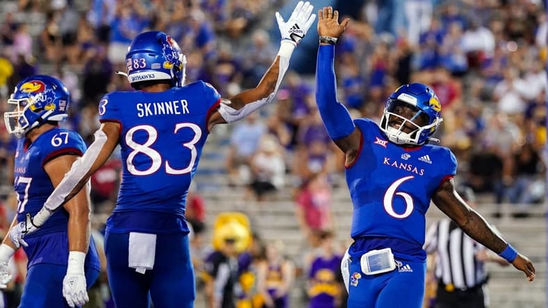 Sep 2, 2022; Lawrence, Kansas, USA; Kansas Jayhawks quarterback Jalon Daniels (6) celebrates with wide receiver Quentin Skinner (83) after scoring a touchdown against the Tennessee Tech Golden Eagles during the first half at David Booth Kansas Memorial Stadium. Mandatory Credit: Jay Biggerstaff-USA TODAY Sports