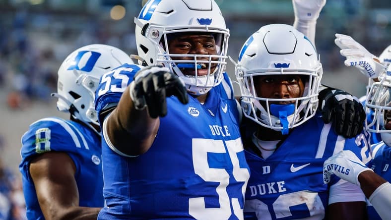Sep 2, 2022; Durham, North Carolina, USA;  Duke Blue Devils offensive lineman Andre Harris (55) and Duke Blue Devils running back Jaylen Coleman (22) celebrate during first half of the game against Temple University at Wallace Wade Stadium. Mandatory Credit: Jaylynn Nash-USA TODAY Sports