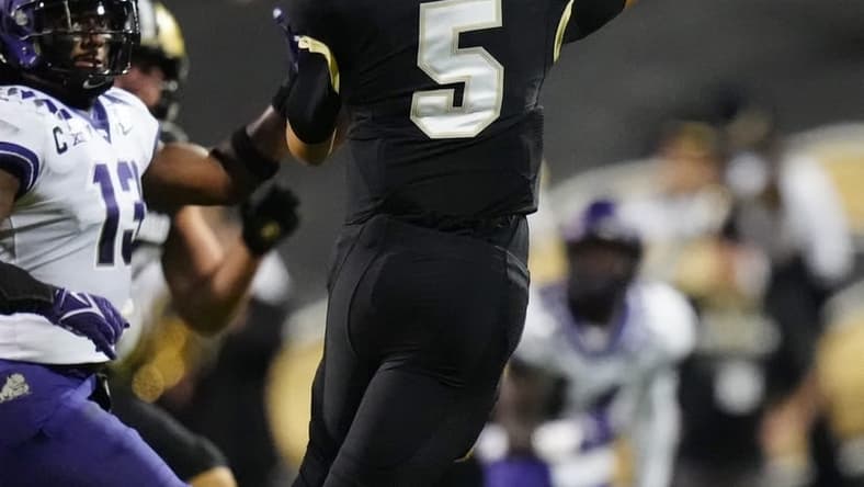 Sep 2, 2022; Boulder, Colorado, USA; Colorado Buffaloes quarterback J.T. Shrout (5) passes the ball in the second quarter against the TCU Horned Frogs at Folsom Field. Mandatory Credit: Ron Chenoy-USA TODAY Sports
