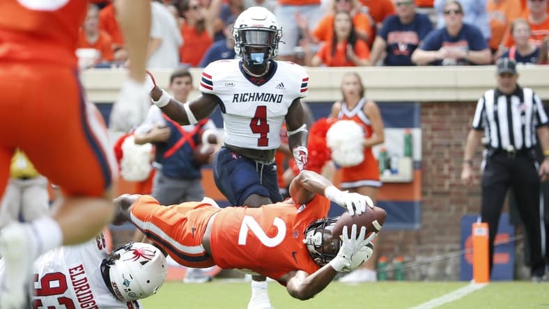 Sep 3, 2022; Charlottesville, Virginia, USA; Virginia Cavaliers running back Perris Jones (2) scores a touchdown in front of Richmond Spiders defensive lineman Ray Eldridge (93) during the first half at Scott Stadium. Mandatory Credit: Amber Searls-USA TODAY Sports