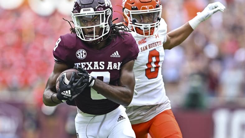 Sep 3, 2022; College Station, Texas, USA;  Texas A&M Aggies wide receiver Yulkeith Brown (8) catches the pass for a touchdown during the first quarter against the Sam Houston State Bearkats at Kyle Field. Mandatory Credit: Maria Lysaker-USA TODAY Sports