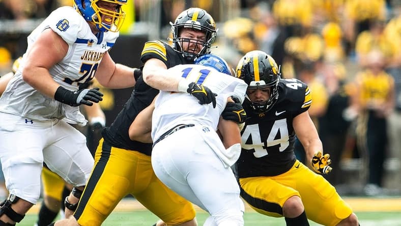 Iowa defensive lineman John Waggoner and linebacker Seth Benson (44) tackle South Dakota State quarterback Mark Gronowski during a NCAA football game, Saturday, Sept. 3, 2022, at Kinnick Stadium in Iowa City, Iowa.

220903 Sdsu Iowa Fb 025 Jpg