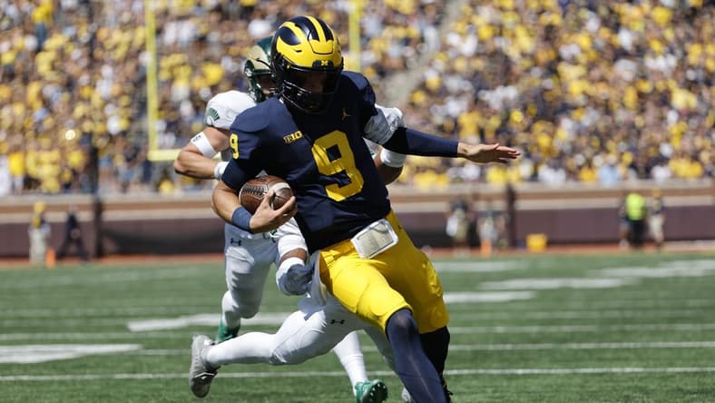 Sep 3, 2022; Ann Arbor, Michigan, USA;  Michigan Wolverines quarterback J.J. McCarthy (9) rushes for a touchdown in the second half against the Colorado State Rams at Michigan Stadium. Mandatory Credit: Rick Osentoski-USA TODAY Sports