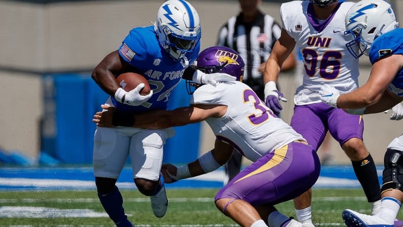 Sep 3, 2022; Colorado Springs, Colorado, USA; Air Force Falcons running back John Lee Eldridge III (24) runs through the tackle of Northern Iowa Panthers linebacker Cameron Baker (39) in the third quarter at Falcon Stadium. Mandatory Credit: Isaiah J. Downing-USA TODAY Sports