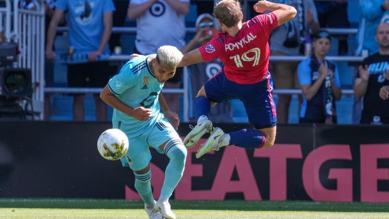 Sep 3, 2022; Saint Paul, Minnesota, USA; FC Dallas midfielder Paxton Pomykal (19) draws a foul on Minnesota United midfielder Emanuel Reynoso (10) in the first half at Allianz Field. Mandatory Credit: Matt Blewett-USA TODAY Sports