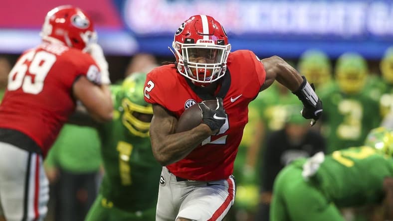 Sep 3, 2022; Atlanta, Georgia, USA; Georgia Bulldogs running back Kendall Milton (2) runs the ball against the Oregon Ducks in the second quarter at Mercedes-Benz Stadium. Mandatory Credit: Brett Davis-USA TODAY Sports