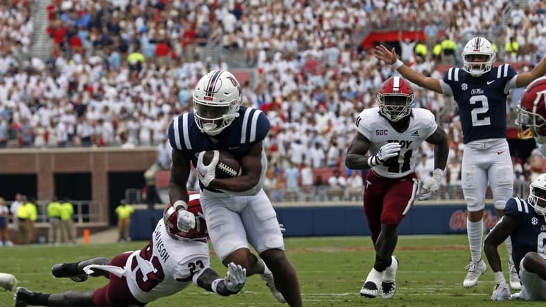 Sep 3, 2022; Oxford, Mississippi, USA; Mississippi Rebels running back Quinshon Judkins (4) runs the ball during the first half against the Troy Trojans at Vaught-Hemingway Stadium. Mandatory Credit: Petre Thomas-USA TODAY Sports