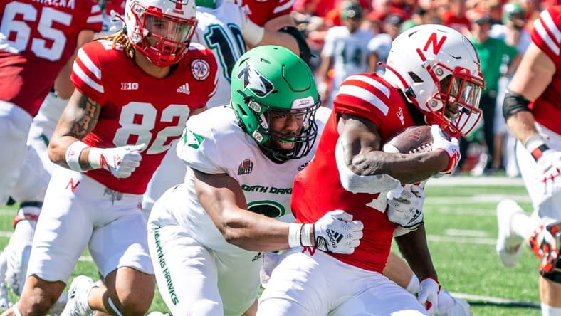 Sep 3, 2022; Lincoln, Nebraska, USA; Nebraska Cornhuskers running back Anthony Grant (10) runs against North Dakota Fighting Hawks linebacker Marcus Vaughn-Jones (9) during the second quarter at Memorial Stadium. Mandatory Credit: Dylan Widger-USA TODAY Sports