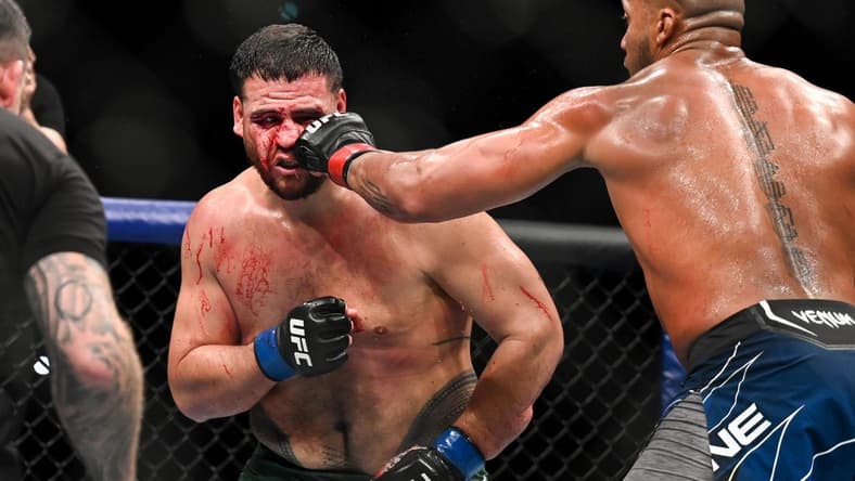 Sep 3, 2022; Paris, FRANCE; Ciryl Gane (red gloves) and Tai Tuivasa (blue gloves) during UFC Fight Night at Accor Arena. Mandatory Credit: Per Haljestam-USA TODAY Sports