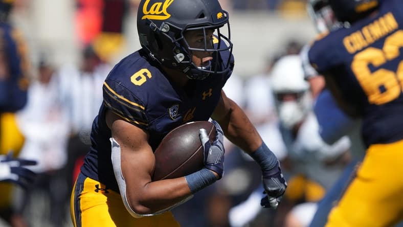 Sep 3, 2022; Berkeley, California, USA; California Golden Bears running back Jaydn Ott (6) carries the ball against the UC Davis Aggies during the third quarter at FTX Field at California Memorial Stadium. Mandatory Credit: Darren Yamashita-USA TODAY Sports