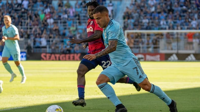 Sep 3, 2022; Saint Paul, Minnesota, USA; Minnesota United midfielder Franco Fragapane (7) is defended by FC Dallas midfielder Ema Twumasi (22) in the first half at Allianz Field. Mandatory Credit: Matt Blewett-USA TODAY Sports