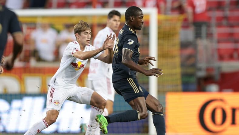 Sep 3, 2022; Harrison, New Jersey, USA; Philadelphia Union defender Nathan Harriel (26) controls the ball against New York Red Bulls midfielder Daniel Edelman (75) during the first half at Red Bull Arena. Mandatory Credit: Vincent Carchietta-USA TODAY Sports